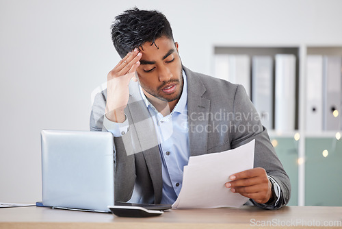 Image of Businessman, laptop and stress with budget, paper and headache. for anxiety, headache and burnout in office. Corporate man, worker and mental health, debt and frustrated with report, mistake or tired