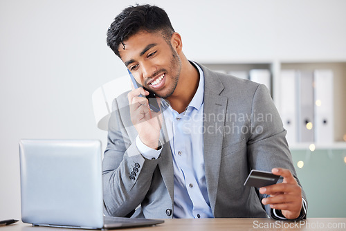 Image of Business man, credit card and phone call for banking, ecommerce and payment for online shopping with laptop for finance work. Corporate leader talking on smartphone about fintech or investment