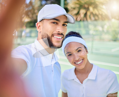 Image of Selfie, tennis and sports with a couple on a court to take a photograph after their training or game. Portrait, fitness and sport with a man and woman tennis player posing for a picture together