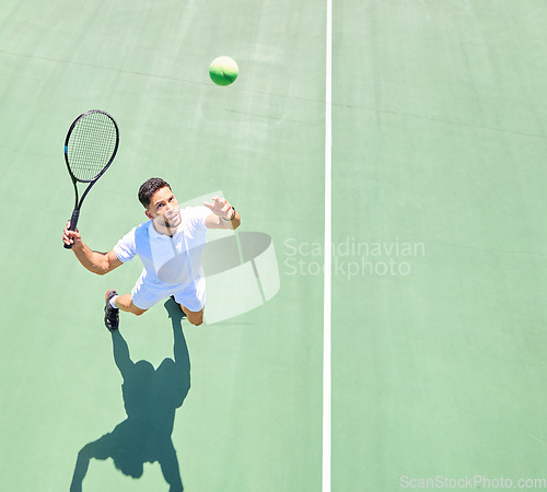 Image of Tennis, mockup and serve with a sports man playing a game on a tennis court outoor from above. Fitness, sport and exercise with a male tennis player hitting a ball during a game or match outside