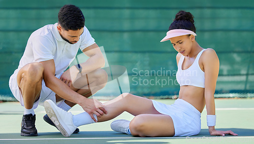 Image of Tennis player, woman and injury legs with man, help and care on tennis court at training. Coach, mentor and training helping girl at match, sport or game with pain, muscle or emergency at workout