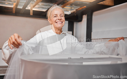 Image of Beekeeper, honey farming and agriculture with a woman farmer working in a warehouse or factory. Farm, sustainability and industry with a female at work in agricultural production or manufacturing