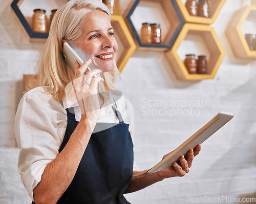 Image of Phone call, tablet and honey with a retail woman recording an online order via mobile communication. Business, ecommerce and nectar sales with a female employee talking while working in her store