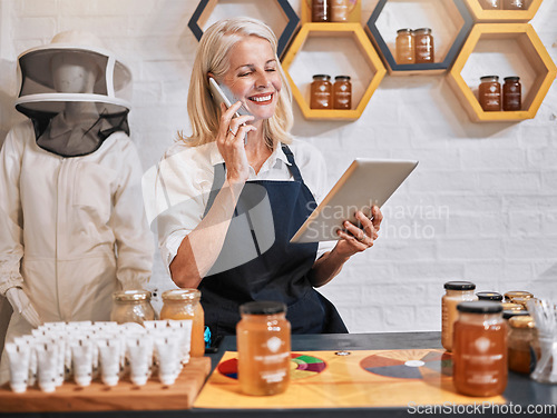 Image of Small business woman, tablet and phone call in honey store for consulting, marketing or advertising in retail. Happy elderly female business owner working in a organic shop on phone with touchscreen