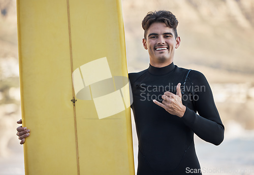 Image of Happy surfer, hand sign and man, portrait and motivation, beach and summer sports, freedom and happiness in sunshine. Surfing board, shaka and smile guy, ocean and relax, adventure and Miami vacation