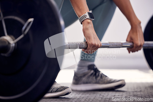 Image of Fitness, exercise and strong, woman with barbell doing deadlift during workout and weight training for a healthy body. Sports model with a watch and weights for motivation, health and wellness