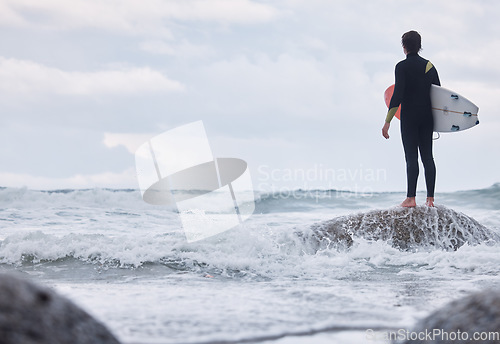 Image of Sports, ocean surfing and man ready for fitness challenge, nature practice training or waves travel in sea water mock up. Sky storm clouds, adventure and mockup back view of surfer with freedom peace