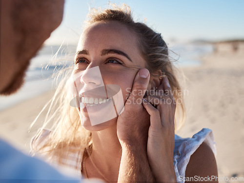 Image of Woman, face and man hand for love, support and care, together on beach and holiday in summer. Couple, trust and happy relax vacation for honeymoon, quality time or marriage with husband holding wife