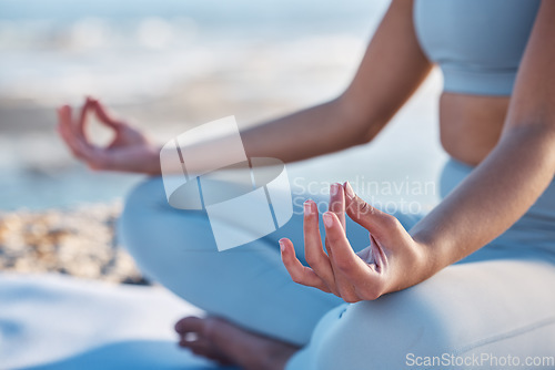 Image of Yoga, meditation and zen hands of woman at beach for fitness, exercise and mindfulness in nature, outdoor wellness and peace. Meditate, spiritual and healing person hand sign or lotus pose by a sea