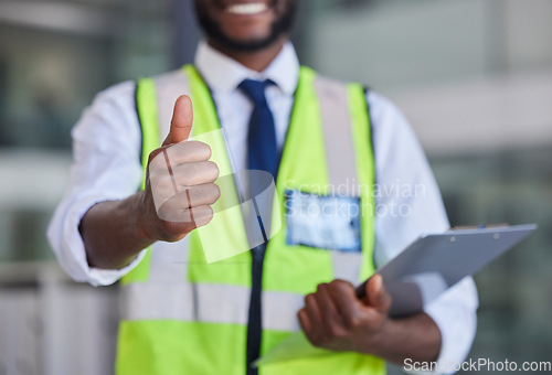 Image of Logistics, thumbs up and clipboard for engineering, construction or architecture with black man doing inspection and quality control. Hand of engineer male showing thank you, safety and success sign