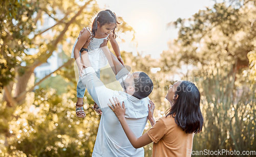 Image of Happy family, nature and love with child, mother and father at nature park together for care, trust and support. Woman, man and lifting girl for freedom and airplane game for fun outdoor on vacation