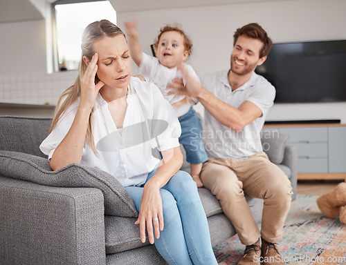 Image of Family, stress and headache of mother on sofa with father, hyper active energy and adhd child. Tired, burnout and woman in living room with boy and dad feeling depression or anxiety in home with kid.