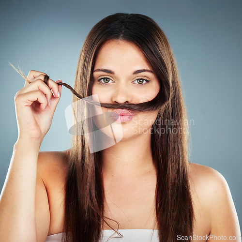 Image of Hair care, funny and woman with salon straight hair, wellness and beauty against a blue background in studio. Comic, luxury and portrait of a model with quality hair salon treatment from hairdresser