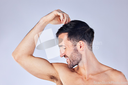 Image of Beauty, armpit and fresh with a man model in studio on a gray background for hygiene or body care. Skincare, health and underarm with a handsome young male posing to promote wellness or bodycare