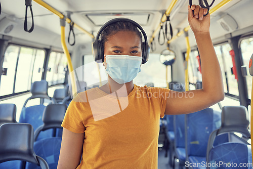 Image of Bus travel, covid and black woman, headphones and music, podcast or radio on urban journey, transport and trip. Portrait of young traveler listening to audio, face mask and corona virus safety rules