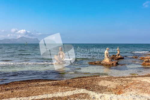 Image of Group of sculptures, statues of people on beach in Can Picafort. Can Picafort, Balearic Islands Mallorca Spain.