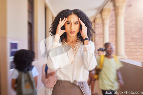 Image of Black woman, teacher and headache stress at school, academy or learning campus with blurred background. Africa woman, portrait and pain for mental health, burnout or tired in education workplace