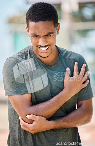 Image of Man in pain, sport injury and elbow broken or sprain, fitness accident and athlete with injured joint. Exercise outdoor, body training medical emergency and muscle inflammation with orthopedic issue.