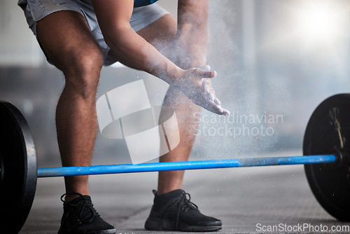 Image of Strong man, powder hands and barbell exercise, challenge and workout in gym, fitness club and body muscle. Closeup of bodybuilder, chalk and weightlifting, grip and training, performance and power