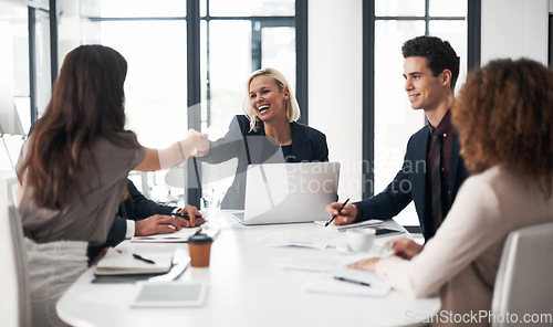 Image of Business people, handshake and meeting for hiring, partnership or collaboration at office conference. Happy woman shaking hands with employee in recruiting, team growth or agreement deal at workplace