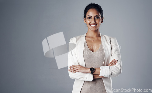Image of Space, arms crossed and portrait of business woman in studio for professional, natural and mockup. Happy, corporate and career with face of female employee on grey background for manager and pride