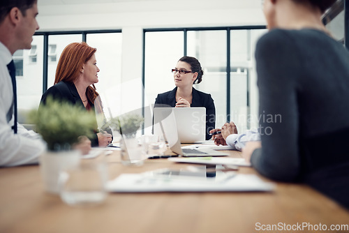 Image of Meeting, planning and business people with laptop in office for creative, collaboration and strategy discussion. Teamwork, brainstorming and designer team sharing goal, vision or design proposal plan