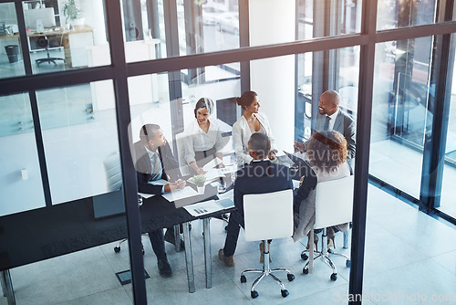 Image of Collaboration, business meeting and team in discussion in the office for brainstorming or planning. Teamwork, company and group of corporate people working on project together in workplace boardroom.