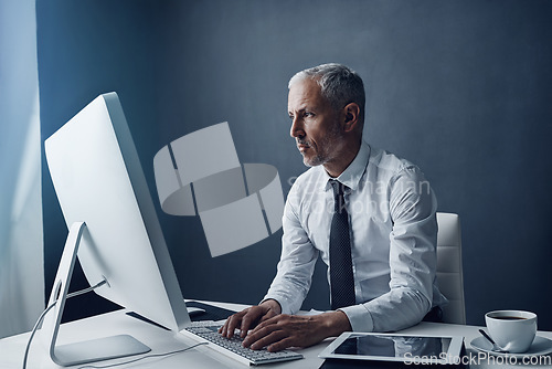 Image of Computer, typing accountant and senior man in office, working on project online or mockup. Desktop, writing and serious manager at desk for reading email, research information or business auditor.