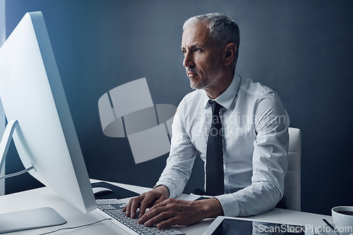Image of Computer, typing accountant and mature man in office, working and isolated on a studio background mockup. Tech, writing and serious manager at desktop for reading email, research or business auditor.