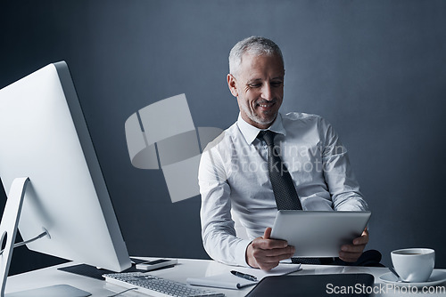 Image of Tablet, accountant and elderly business man in studio isolated on a dark background mockup space. Technology, happy and manager at desk, executive or auditor working on research, email or reading app