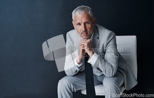 Image of Serious portrait of senior lawyer on chair with confidence, mockup space and dark background in studio. Pride, professional career ceo and executive attorney, mature businessman or law firm boss.