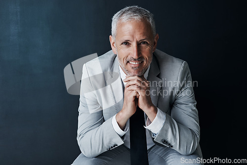 Image of Happy portrait of senior attorney sitting with confidence, mockup space and dark background in studio. Pride, professional ceo and executive lawyer man with smile, mature businessman or law firm boss