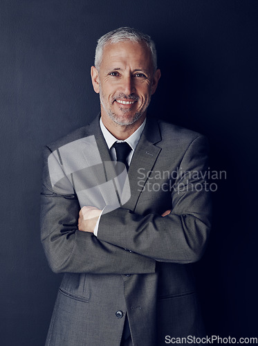 Image of Smile, confidence and studio portrait of businessman in suit, arms crossed and pride on dark background. Boss, ceo and happy business owner with professional career, senior model executive with job.