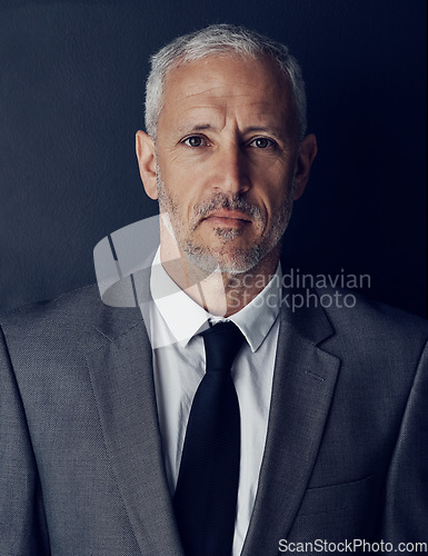 Image of Portrait, management and mindset with a man CEO in studio on a dark background for leadership. Face, manager and corporate boss with a senior business man looking serious about his company mission