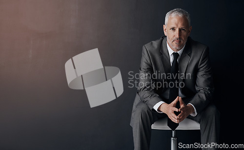 Image of Mock up, chair and serious portrait of lawyer, attorney or businessman with confidence on dark background in studio space. Boss, ceo or business owner, proud senior executive director at law firm.