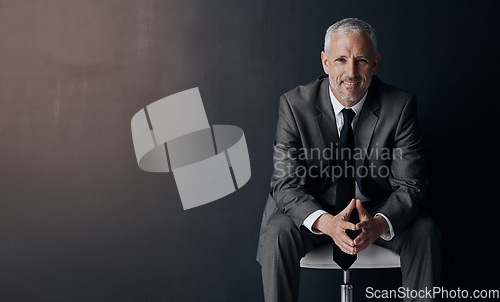 Image of Mock up, chair and happy portrait of lawyer, attorney or businessman with confidence on dark background in studio space. Boss, ceo or business owner with smile, senior executive director at law firm.