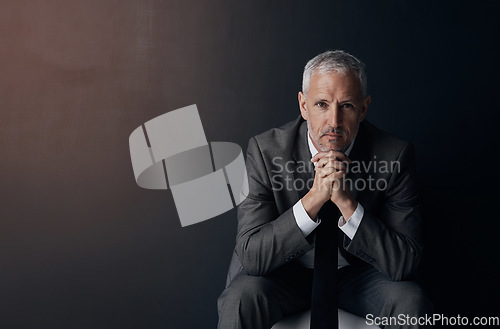 Image of Mockup, chair and portrait of serious businessman, lawyer or attorney with confidence on dark background and studio space. Boss, ceo and professional business owner, proud senior director at law firm