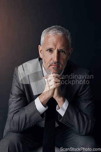 Image of Boss, chair and serious portrait of lawyer, attorney or businessman with ceo on dark background in studio. Confidence, pride and legal business owner, proud senior executive director at law firm.