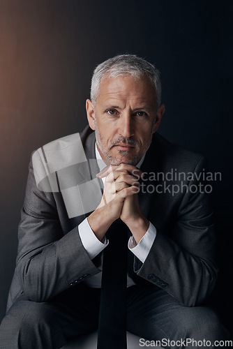 Image of Serious portrait of senior lawyer, confident businessman or legal advisor in suit on dark background in studio. Boss, ceo or business owner with pride, senior executive director or law firm attorney.
