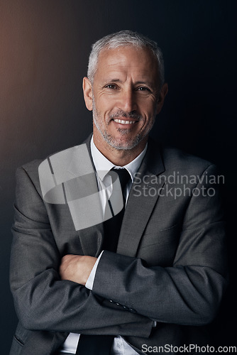 Image of Portrait, smile and businessman with confidence, lawyer or attorney on dark background in studio. Proud boss, ceo and professional business owner, happy senior director at law firm with arms crossed.