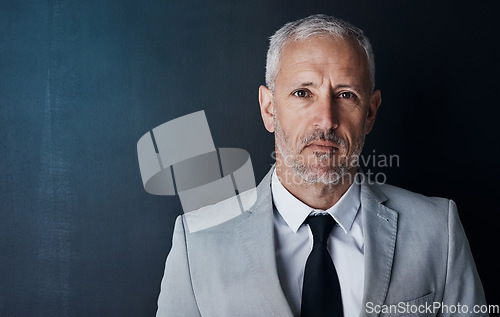 Image of Senior executive, business man and headshot, portrait with confidence and management on dark background. Male CEO, corporate director in studio and suit with ambition, empowerment and mockup space