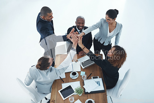 Image of High five, happy and above of business people in meeting with support, teamwork and motivation. Smile, target and a group of corporate employees with together hands for collaboration and achievement