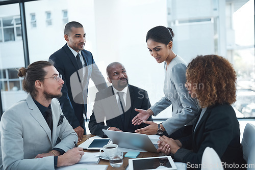 Image of Business meeting, planning and people with laptop in discussion for ideas, strategy and collaboration. Corporate office, teamwork and men and women working on report, group project and proposal