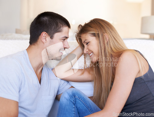 Image of Relax, talk and happy couple bond on a sofa with conversation, gossip and hangout in their home together. Love, smile and woman with man in a living room with care, laugh and soulmate connection