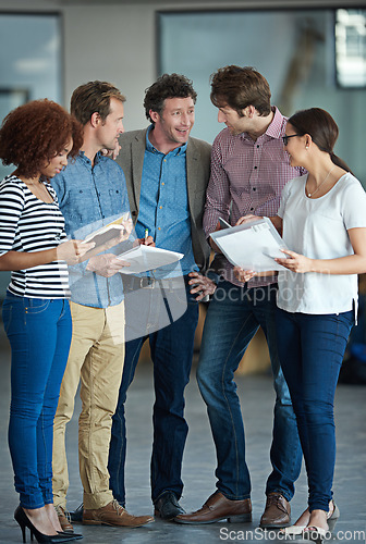 Image of Team planning, talking or business people with ideas in meeting for brainstorming together in office. Diversity, digital or IT employees networking with technology, notes or documents in workplace