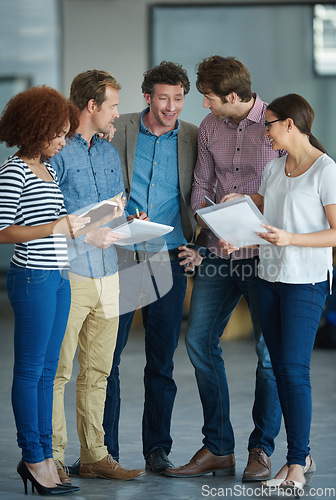 Image of Team planning, discussion or developers with ideas in meeting for brainstorming as a group in office. Diversity, people or programmers networking with technology, notes or documents in workplace