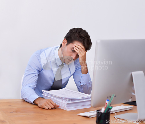 Image of Stress, business man and headache with paperwork from corporate career at office desk. Anxiety, lawyer deadline and burnout of a male professional with notes, contracts and report with fatigue