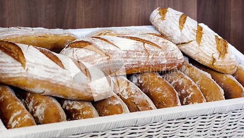 Image of Bread in a basket, bakery presentation and food with baked goods, wheat product in store and catering. Baguette, hospitality industry with cafe or patisserie in France, nutrition and cuisine