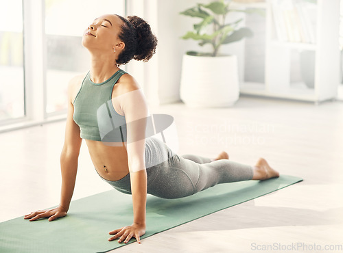 Image of Yoga mat, stretching and woman body on living room floor for wellness, exercise or mental health at home. Energy, meditation and lady relax with core training, stretch or holistic healing exercise