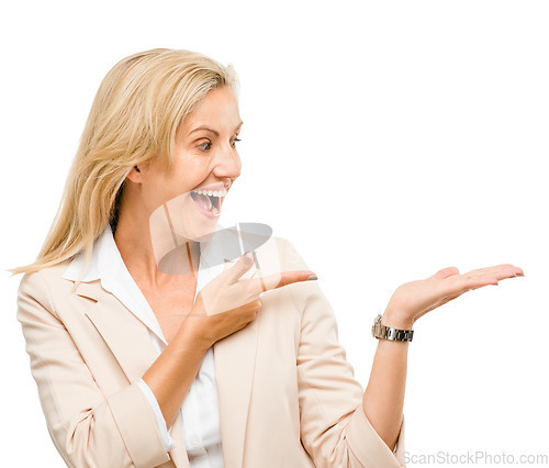 Image of Wow, smile and mature woman with hand pointing in studio to exciting deal or promo on white background. Finger, omg and face of excited lady with product placement, coming soon sale or menu steps